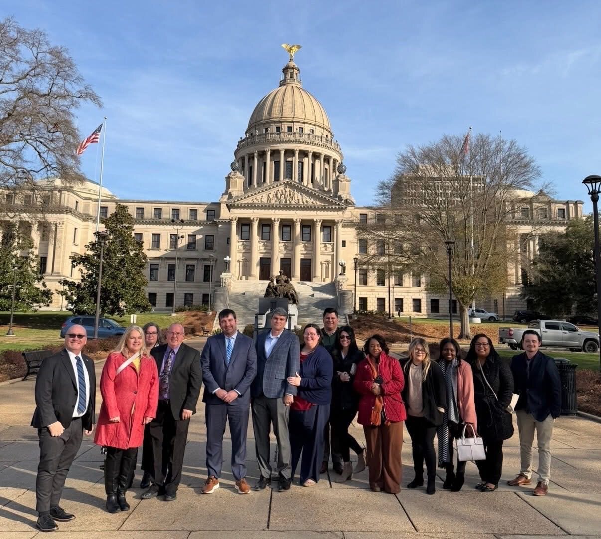 Group standing outside the capitol building during the Chamber trip