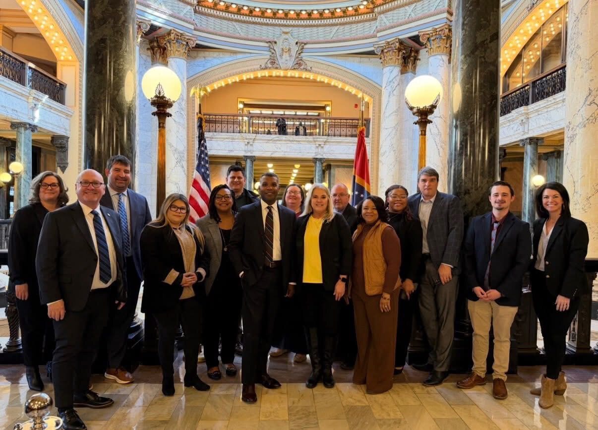 Group standing together inside the capitol during the Chamber trip