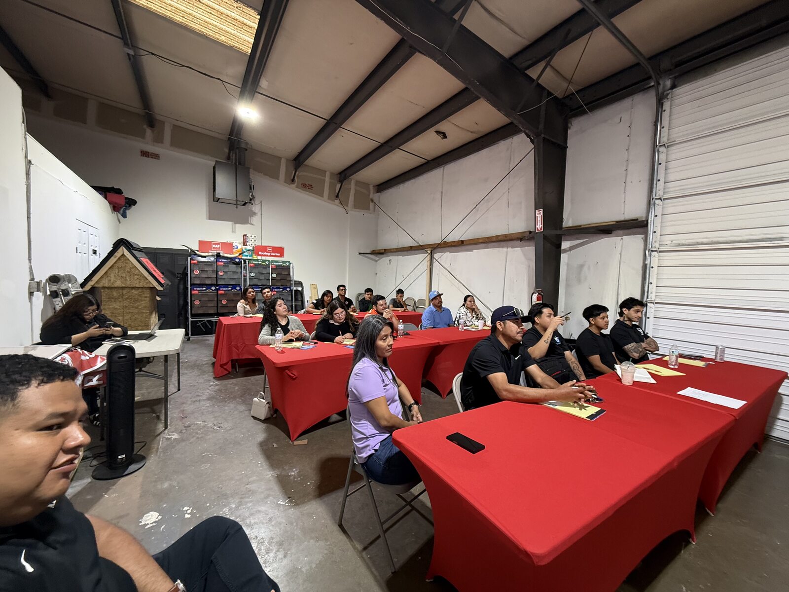 Colleagues seated at tables for the GAF CARE class