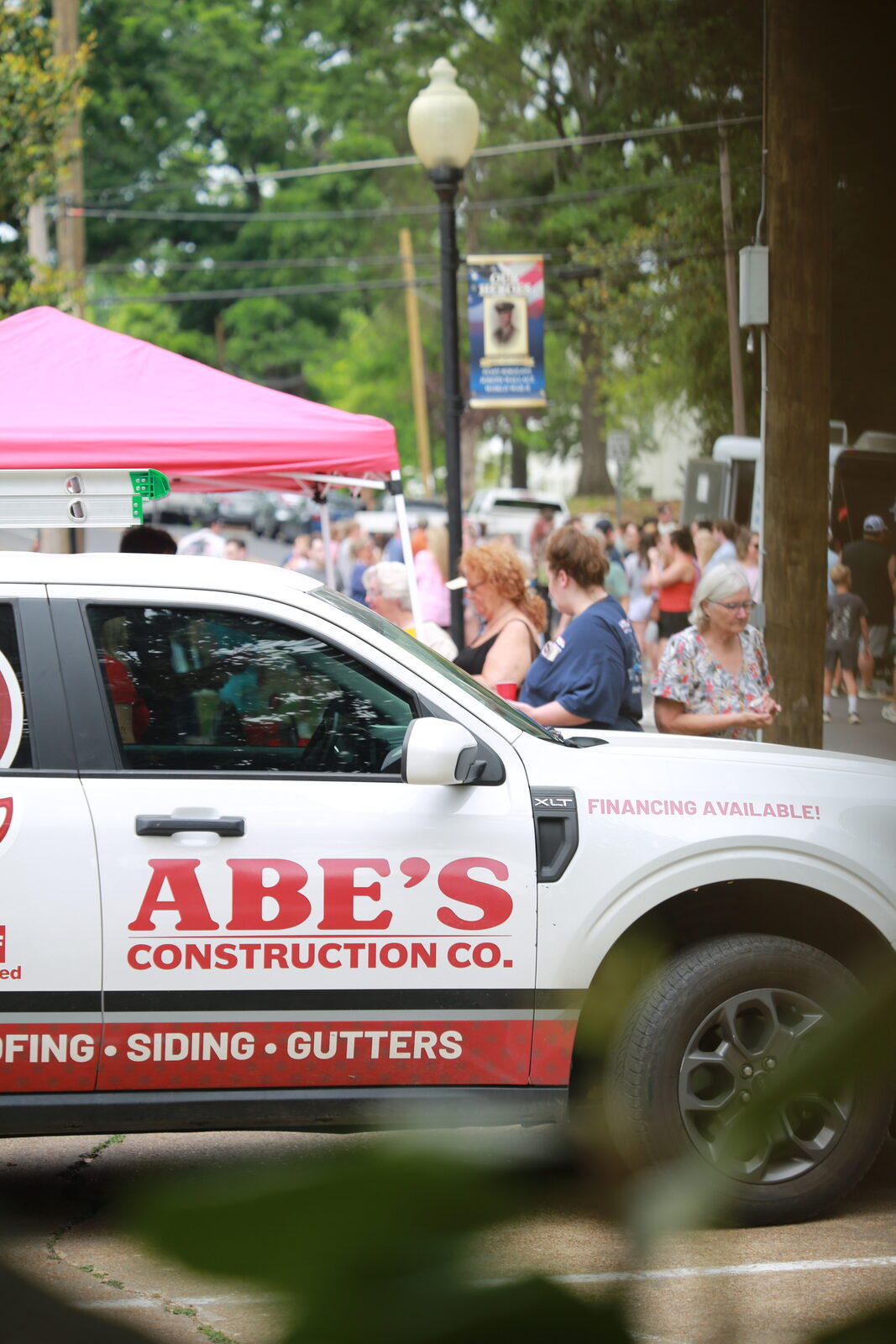 Abe's Construction Co. truck parked near the crowd at Hernando A'Fair