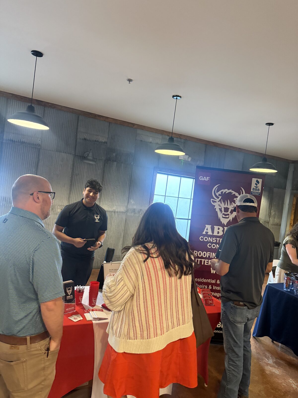 People gathered at Abe's Construction Co. booth during the Hernando quarterly luncheon