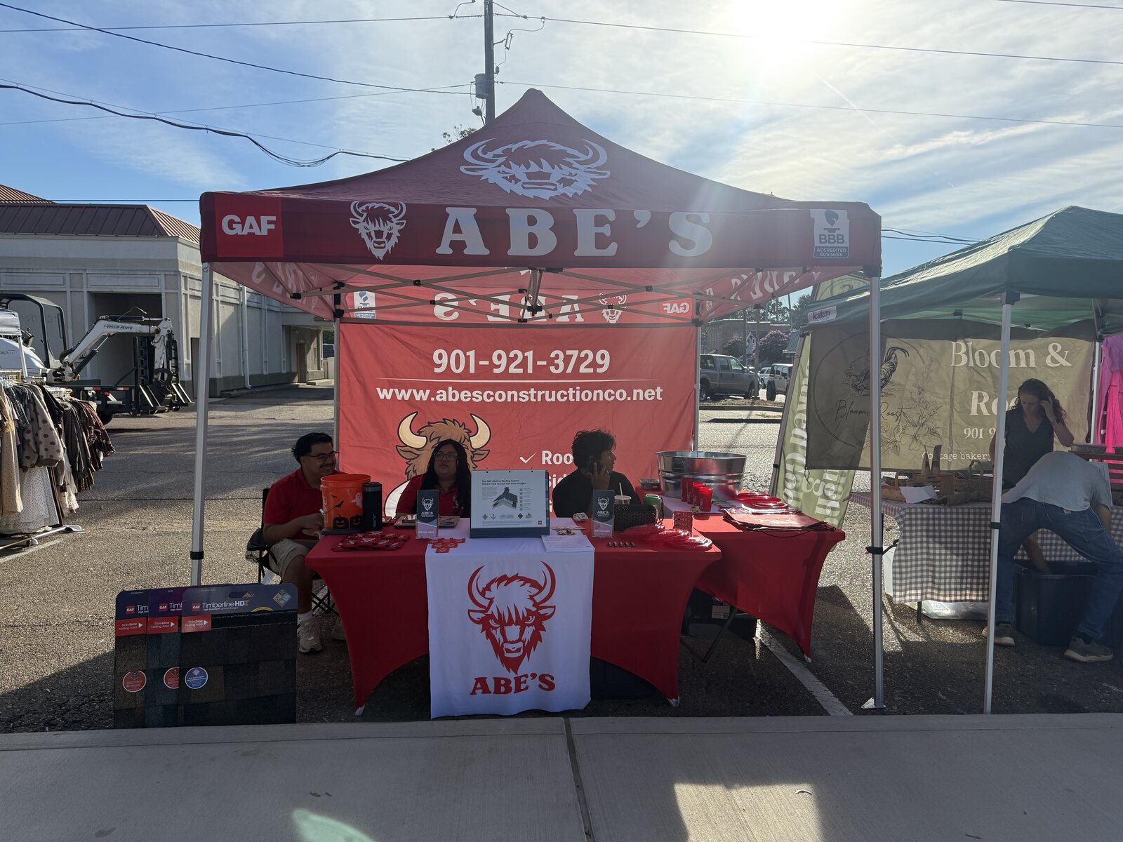 Abe's red canopy and table at the Hernando Water Tower Festival