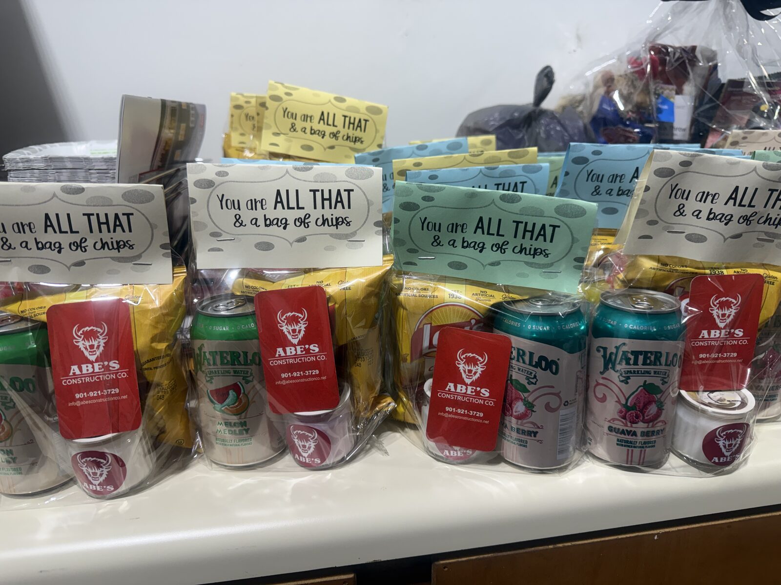 Appreciation bags with snacks and drinks from Abe's Construction Co.